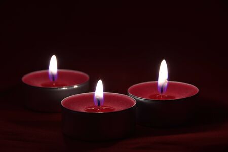 Romantic card with beautiful red candles in the darknessの写真素材