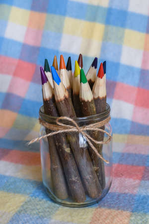 The set of colored pencils in a glass jarの写真素材