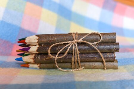 The set of colored pencils tied with a ropeの写真素材