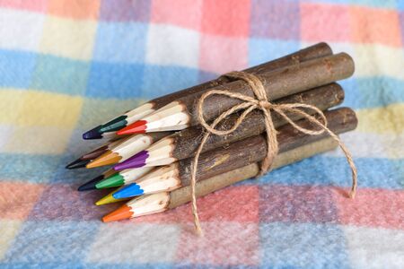 The set of colored pencils tied with a ropeの写真素材