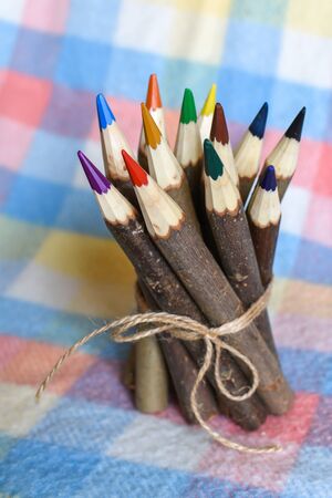 The set of colored pencils tied with a ropeの写真素材