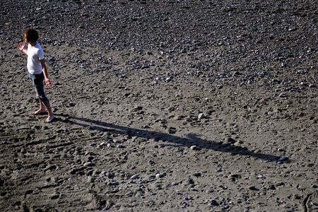 Boy and its shadowの写真素材