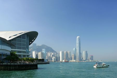 Skyline of modern business district and ferry boat, Hong Kong