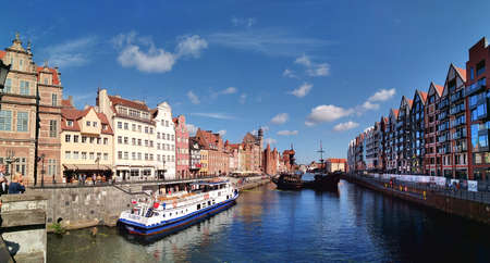 Gdansk, Poland - September 04 2019. Panorama of the old city from the Green Bridge on river trams....