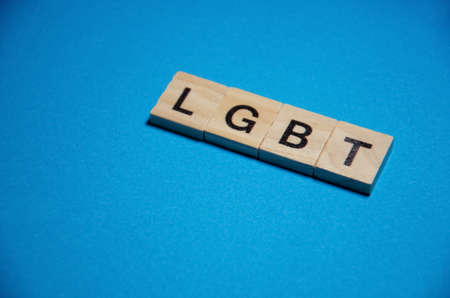 Text message LGBT for protest action. Selective focus on Lettering LGBT. Banner on blue background with copy space. Concept of Human rights.の写真素材