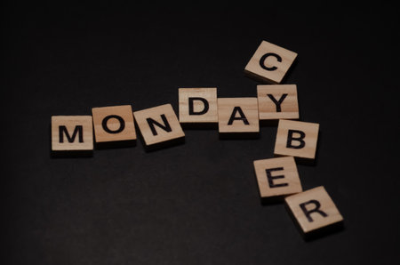 Cyber monday shopping concept. Inscription Cyber monday lying on black background. Selective focus on Lettering with copy space.の写真素材