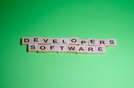 IT concept. Selective focus on Inscription software developers on blurred background. Banner on green background with copy space.の写真素材