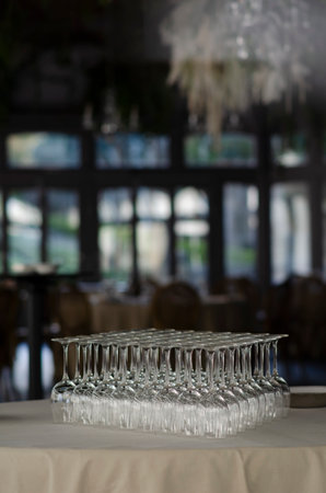 Empty wine glasses on a table in a restaurant. Selective focus.の写真素材