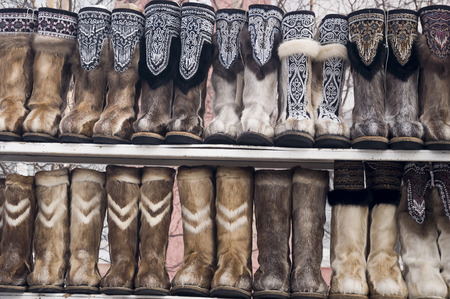 Nenets boots from deer fur are selling in the winter streetの写真素材