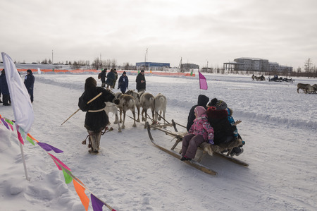 New Urengoy, YaNAO, North of Russia. March 1, 2016. The holiday of north nationality. Nenets man and north deer in winter dayのeditorial素材