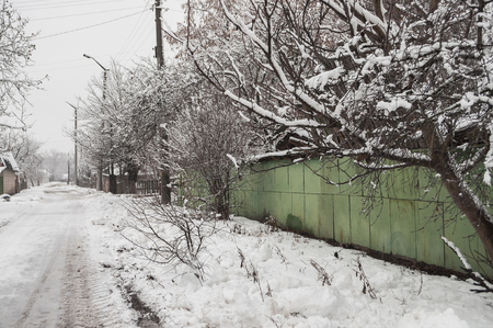 Winter suburb covered with a huge amount of white snow. Streets of small townの写真素材