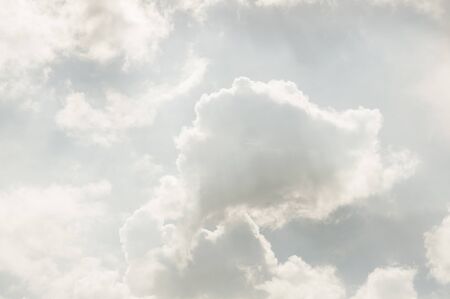 Light gray sky with much clouds. Background of heaven. Beautiful eveningの写真素材