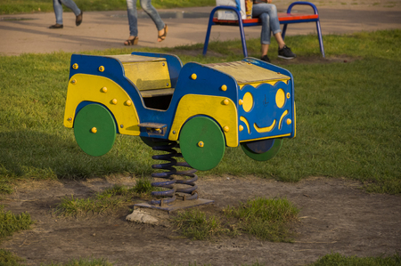 Childrens playground on the yard in summer. Rest with little childの写真素材