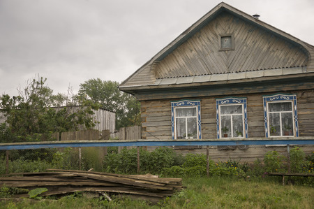 Heavy gray clouds in the cold autumn. Traveling on the suburb roads. People livingの写真素材