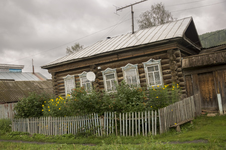Heavy gray clouds in the cold autumn. Traveling on the suburb roads. People livingの写真素材