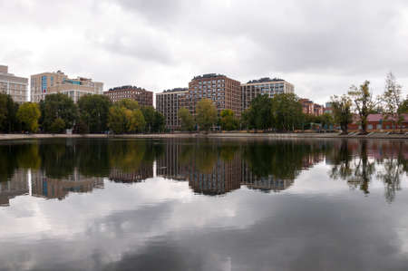 Ufa, Russia, st. Lenina, Park of Culture and Leisure named after Ivan Yakutov. May 11, 2022. Modern buildings near the large lake. green trees aroundのeditorial素材