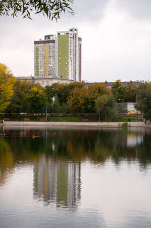 Ufa, Russia, st. Lenina, Park of Culture and Leisure named after Ivan Yakutov. May 11, 2022. Modern buildings near the large lake. green trees aroundのeditorial素材