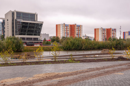 Surgut, Russia, 12 Griboyedov Street, May 11, 2022. Modern buildings and view of the embankment of the Ob riverのeditorial素材