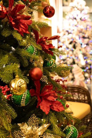 Christmas tree decorated with red and green baubles and ornamentsの写真素材