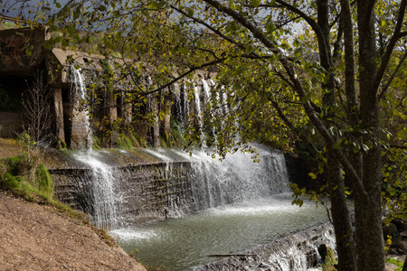 Waterfall.Dam on the river, spillway.の写真素材