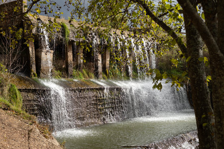 Waterfall.Dam on the river, spillway.の写真素材