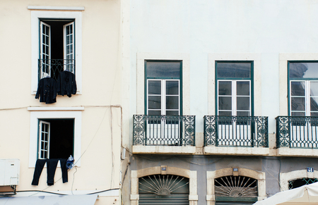 Lisbon Portugal windows drying clothes urban europe cityscape famous place day portuguese capital town district history architecture buildingsの写真素材