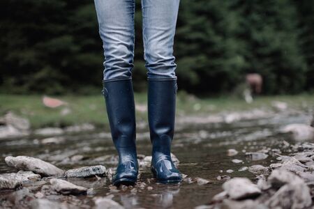 Rubber rain boots mountain river nature exploringの写真素材