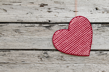 Valentines day background with heart on a wooden backgroundの写真素材