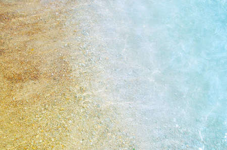waves of the sea in the beach with a sandの写真素材