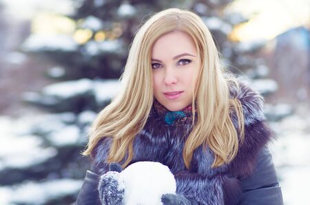girl in frost, in a winter sheepskin coat