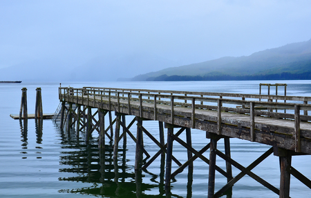 Wooden Bridge Reflection in the Waterの写真素材