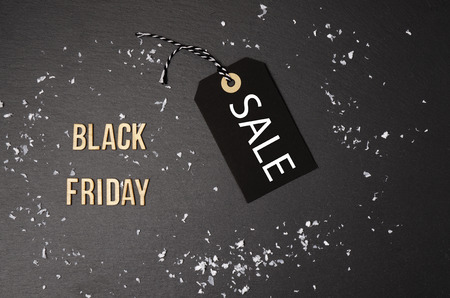 Black background and black price label.  Black Friday. Sales concept. Copy space.  Black paper label...