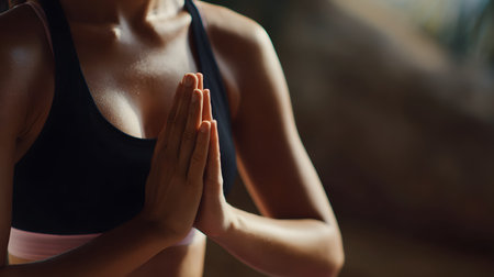 Young woman practicing yoga in the morning. Close-up, selective focus. Healthy lifestyle and relaxation concept. selective focus, copy space, facelessの素材
