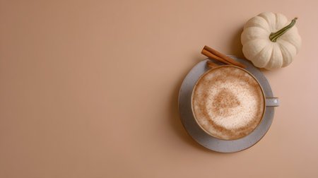 Autumn composition. Cup of coffee, pumpkins, and spices on a white background. Flat lay, top view. Pumpkin latte or cappuccino with cinnamon.の素材