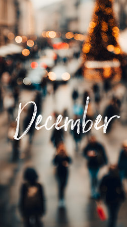 December is written on a blurred background with bokeh Christmas tree lights and people at Christmas marketの素材