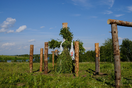 Giant figure of ancient idol is built on a meadow close to a small river on the eve of summer solstice day, Moscow region, Russiaの写真素材