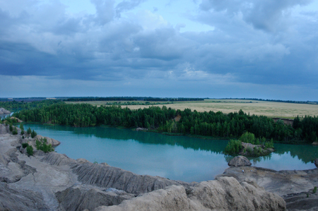 View from the top of the hill over the former brown coal open pits filled now by waters, Ushakov open pits, Tula region, Russiaの写真素材