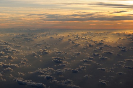 Aerial view of clouds lit by the sun during the sunset, Maldivesの写真素材