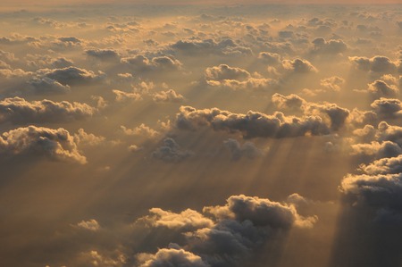 Aerial view of clouds lit by the sun during the sunset, Maldivesの写真素材