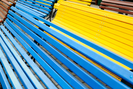 Colourful old benches set in a public garden named after Bauman, Bauman Garden, Moscow, Russiaの写真素材