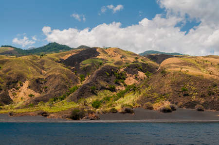 A volcanic island with black sand beaches, Indonesia