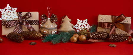Panoramic composition on a red background. Merry christmas and happy new year greeting cardの写真素材