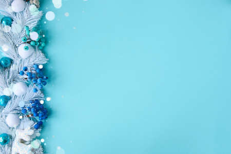 Holiday composition with cones and gift box on a blue background. Merry christmas and happy new year greeting cardの写真素材