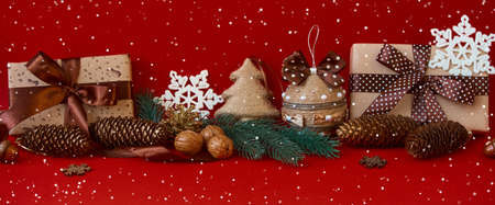 Panoramic composition on a red background. Merry christmas and happy new year greeting cardの写真素材