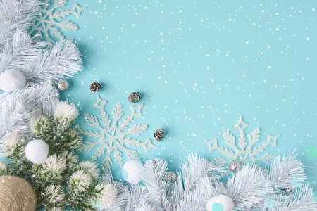 Holiday composition with cones and gift box on a blue background. Merry christmas and happy new year greeting cardの写真素材