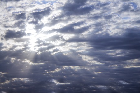 Photo of blue sky with clouds on sunny day, sky with clouds and sun raysの写真素材