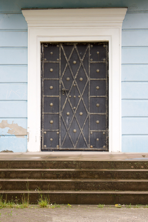 Photo of antique vintage old style forged decorated doorの写真素材