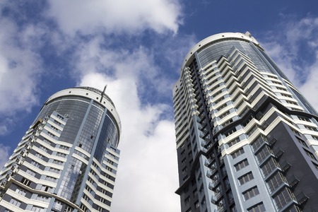 Modern skyscraper perspective ground view on sky background