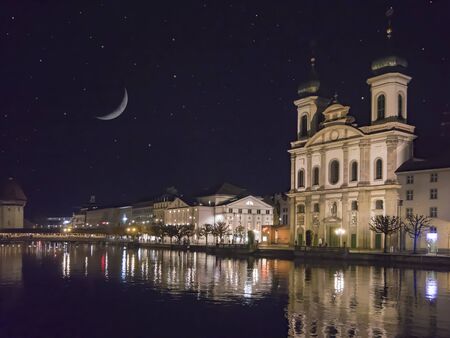 LUCERNE, SWITZERLAND - OCT 130th, 2018: Classic beautiful and colorful swiss cityscape or landscape at magic night. Moon and starsのeditorial素材
