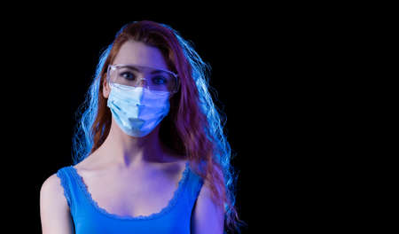 Woman wearing a safety mask and protective glasses.の写真素材